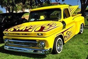 Yellow Chevy truck with flames