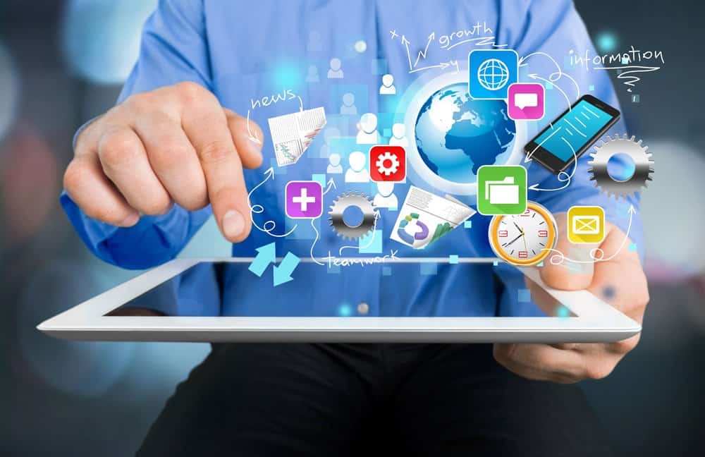 online marketing icons floating above a tablet - Website development