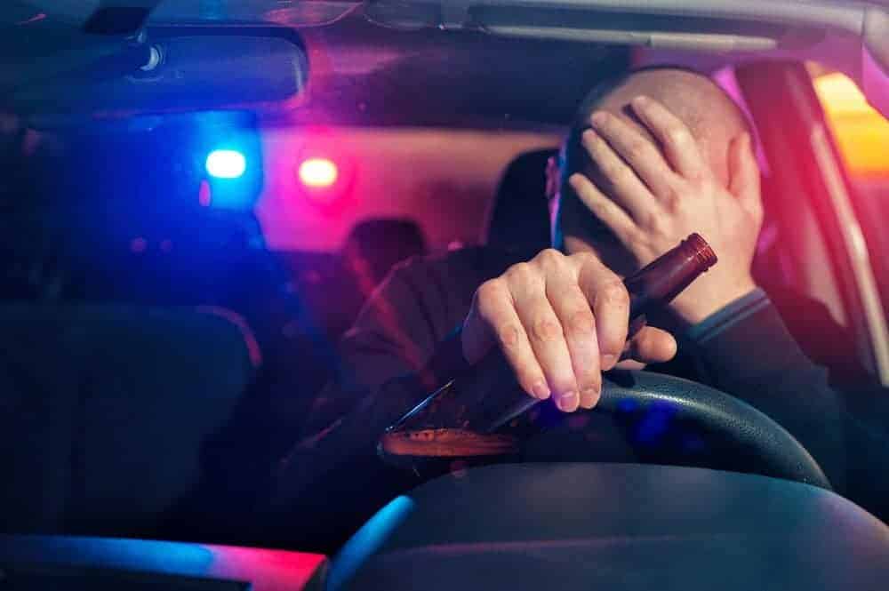 person being pulled over with a beer in hand - Missouri ignition interlock device