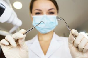 Dentist with dental tools