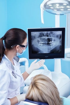 dentist reviewing dental xrays