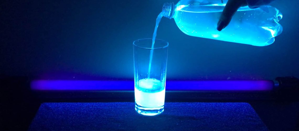 Bottle_of_UV_Illuminated_Tonic_Water_Pouring