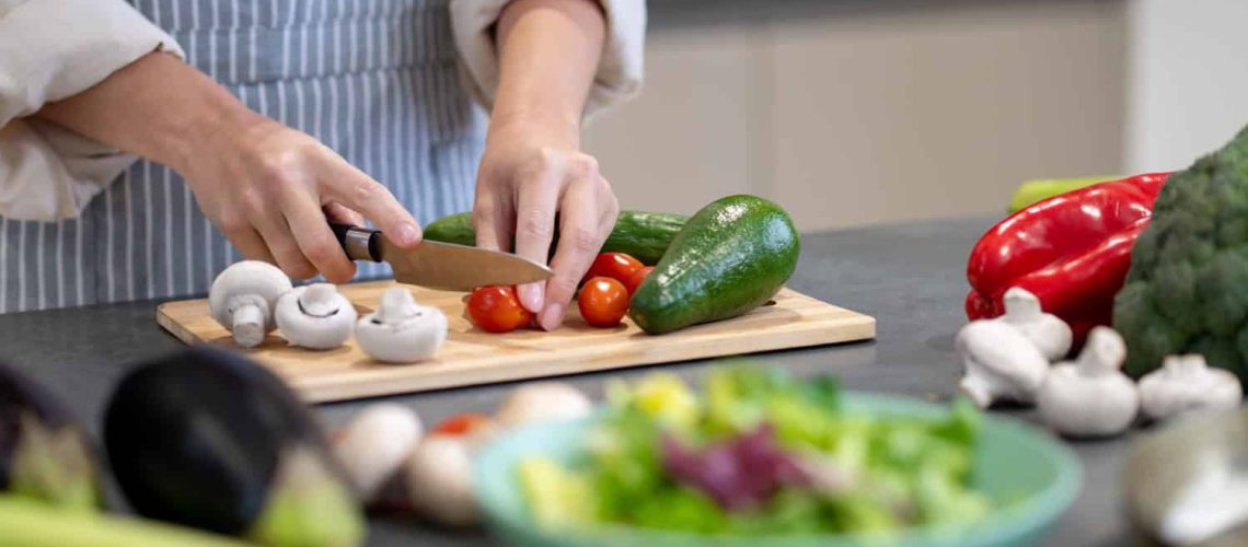 woman-cooking-lunch-cutting-vegetables[1]