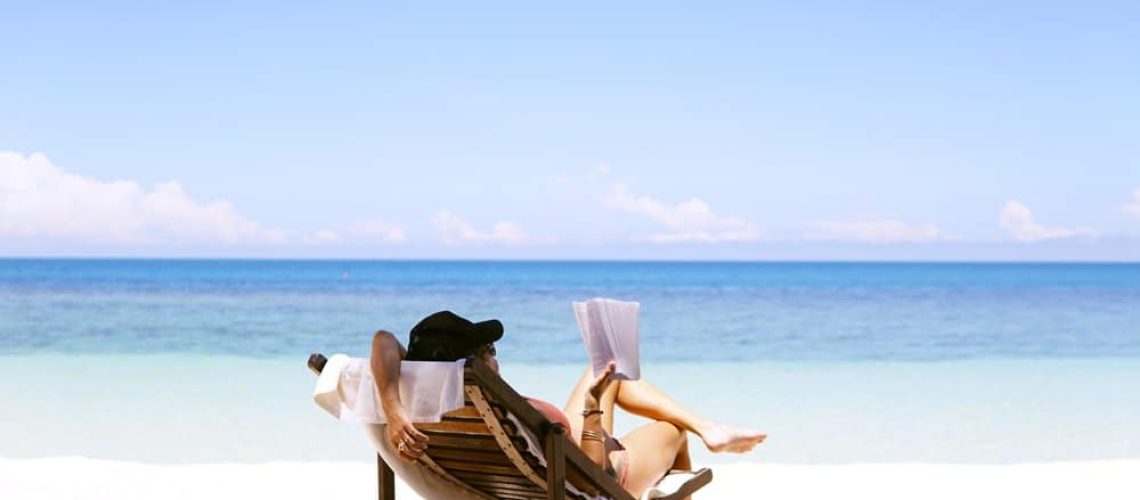 woman-reading-a-book-on-the-beach