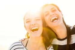 two women smiling with the sun behind them - sleep apnea treatment Idaho Falls