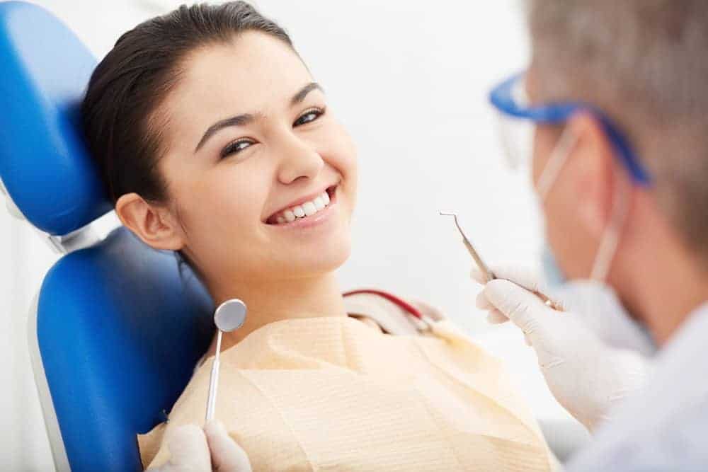 happy dental patient with dentist - Idaho Falls orthodontist
