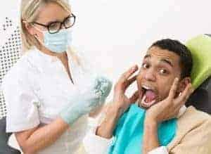 scared dental patient with dentist